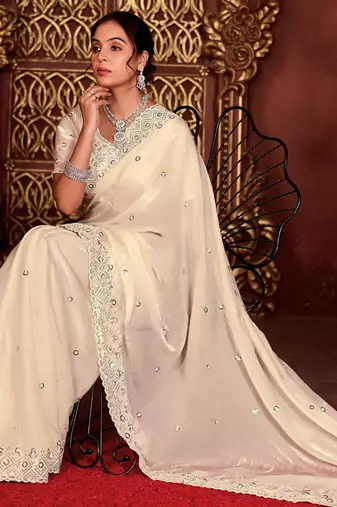 Celebrity inspired cream diamond sequin jaal embroidered border mono nylon fabric saree with unstitched blouse