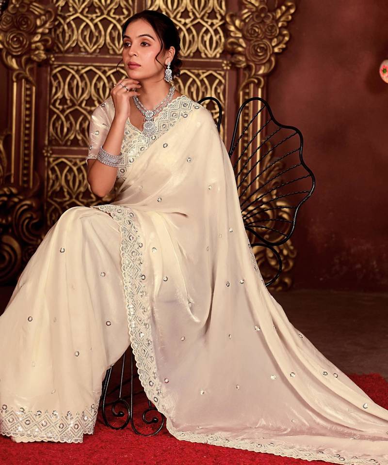 Celebrity inspired cream diamond sequin jaal embroidered border mono nylon fabric saree with unstitched blouse