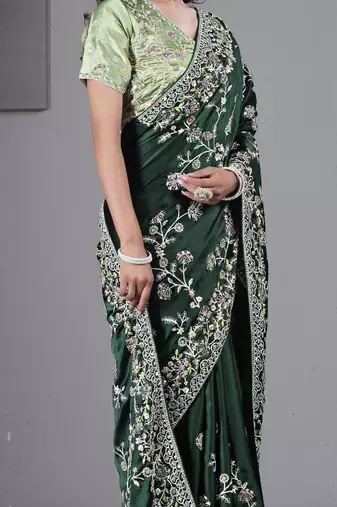 Light weight green embroidered in multi-colored satin saree with unstitched blouse
