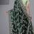 Light weight green embroidered in multi-colored satin saree with unstitched blouse