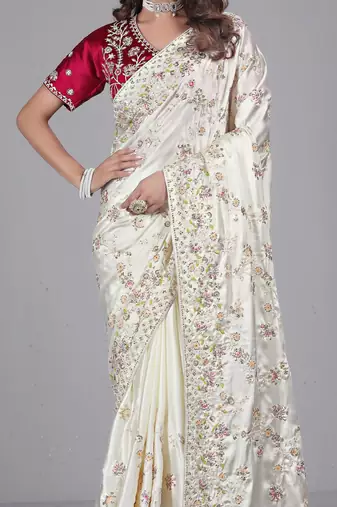 Celebrity type white embroidered in multi-colored satin saree with unstitched blouse