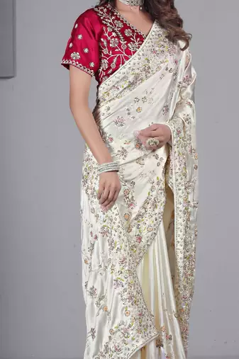 Celebrity type white embroidered in multi-colored satin saree with unstitched blouse