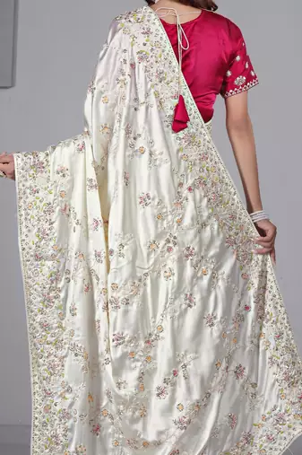 Celebrity type white embroidered in multi-colored satin saree with unstitched blouse