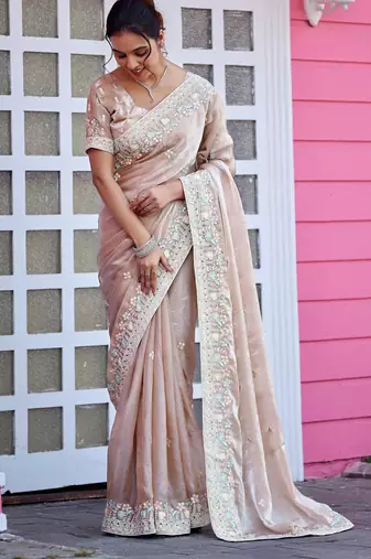 Trendy champagne beige multicolor floral buti embroidered border fandy satin saree with unstitched blouse