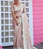Trendy champagne beige multicolor floral buti embroidered border fandy satin saree with unstitched blouse