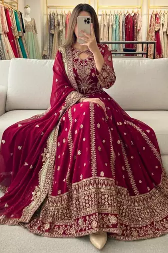 Magenta faux georgette embroidered flared gown set
