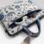  petal posh ivory & navy floral jacquard laptop bag (upto 16")
