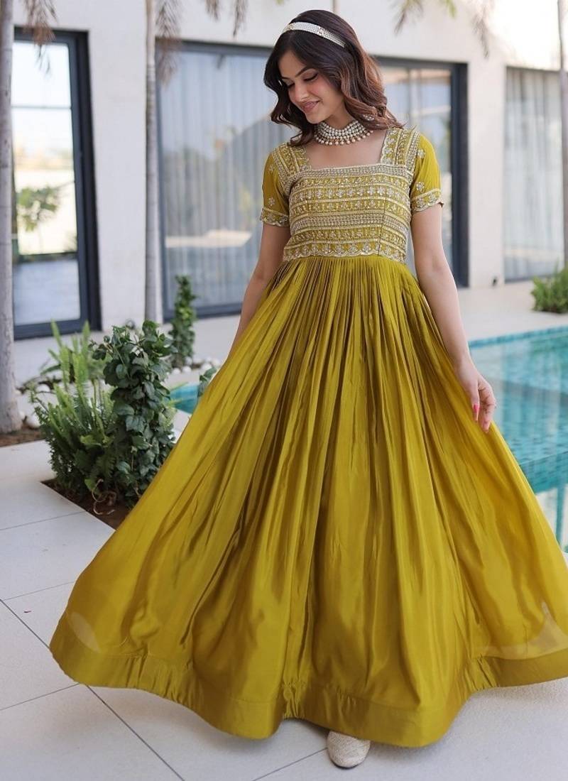 Mehendi color fancy fabric embroidered work readymade gown