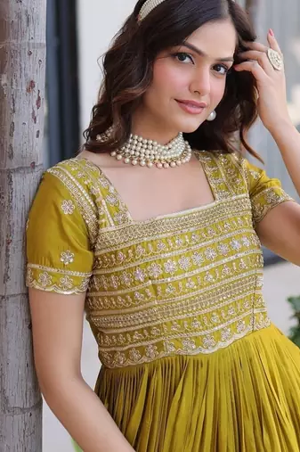 Mehendi color fancy fabric embroidered work readymade gown