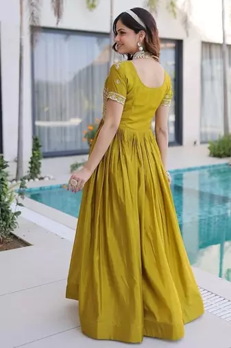 Mehendi color fancy fabric embroidered work readymade gown