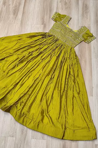 Mehendi color fancy fabric embroidered work readymade gown