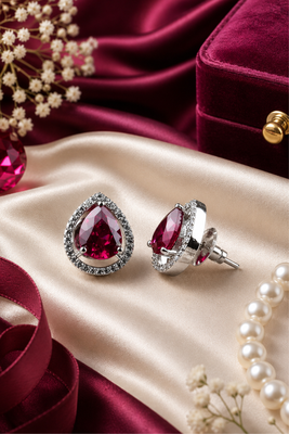 Rhodium finish ruby radiance teardrop studs 1