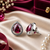 Rhodium finish ruby radiance teardrop studs