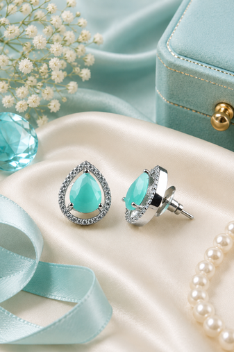 Rhodium finish mint glow teardrop studs