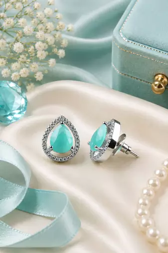 Rhodium finish mint glow teardrop studs