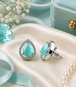 Rhodium finish mint glow teardrop studs