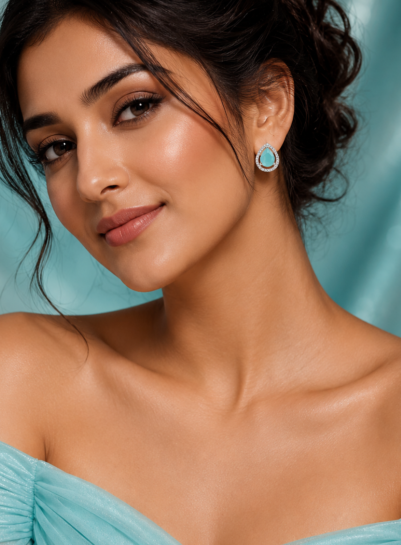 Rhodium finish mint glow teardrop studs