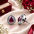 Rhodium finish ruby radiance teardrop studs