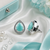 Rhodium finish mint glow teardrop studs