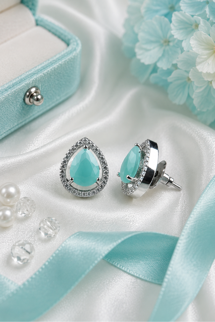 Rhodium finish mint glow teardrop studs