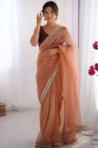 Orange soft dual shade gold net saree with sequence lace border