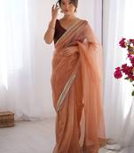 Orange soft dual shade gold net saree with sequence lace border
