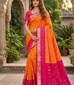 Orange color pochampally silk blend ikkat pattern zari woven border sarees