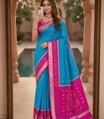 Sky blue color pochampally silk blend ikkat pattern zari woven border sarees