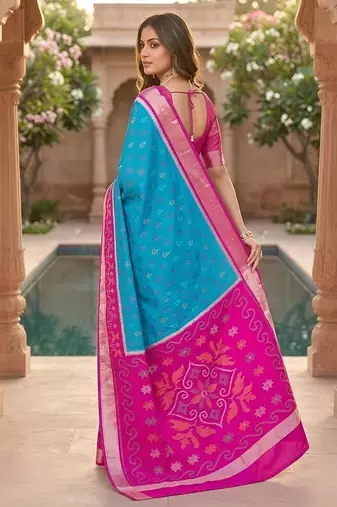Sky blue color pochampally silk blend ikkat pattern zari woven border sarees