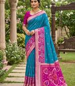 Sky blue color pochampally silk blend ikkat pattern zari woven border sarees