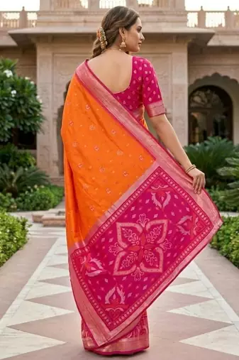 Orange color pochampally silk blend ikkat pattern zari woven border sarees