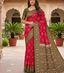 Rani pink color silk blend ikkat pattern woven work sarees