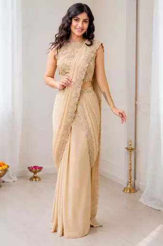Cream georgette embroidered saree with sequins work