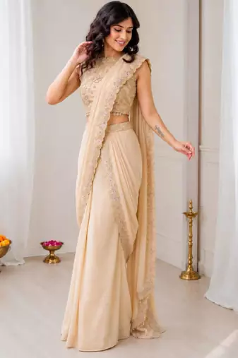 Cream georgette embroidered saree with sequins work