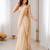 Cream georgette embroidered saree with sequins work