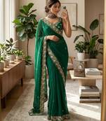 Green satin embroidered saree with sequins work