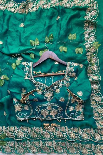 Green satin embroidered saree with sequins work