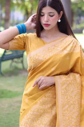 Yellow art silk woven saree with zari work
