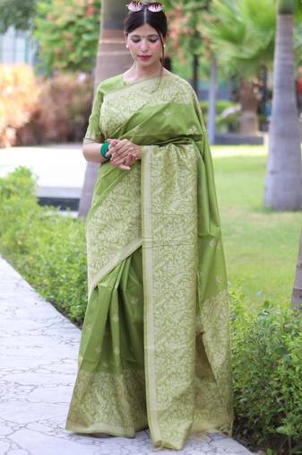 Green art silk woven saree with zari work