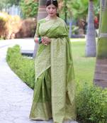 Green art silk woven saree with zari work