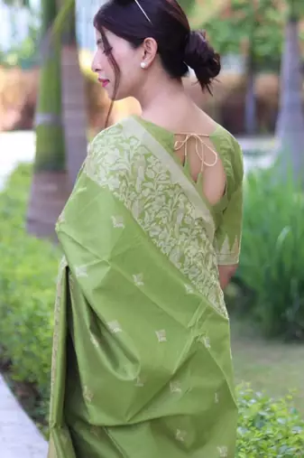 Green art silk woven saree with zari work