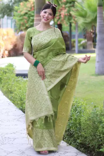 Green art silk woven saree with zari work