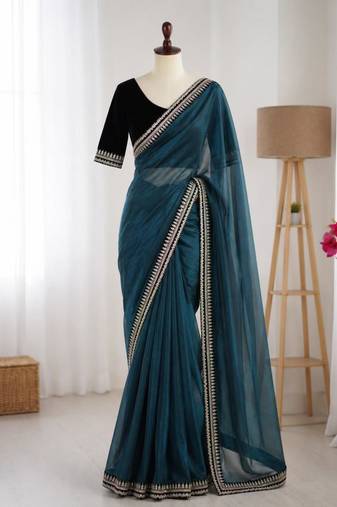 Teal net embroidered saree with sequins work