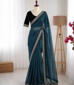 Teal net embroidered saree with sequins work