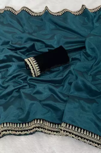 Teal net embroidered saree with sequins work