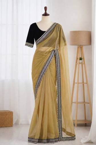 Yellow net embroidered saree with sequins work