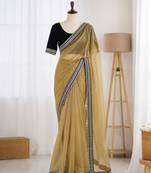 Yellow net embroidered saree with sequins work
