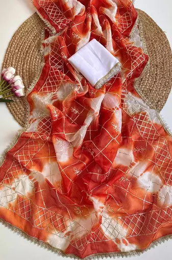 Orange silk blend printed saree with tie dye