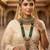 Green 2-layer bridal jewelry set with earrings, maang tikka, pasha, nath & panja | gold plated