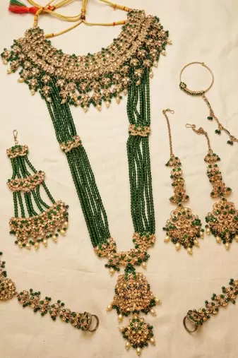 Green 2-layer bridal jewelry set with earrings, maang tikka, pasha, nath & panja | gold plated